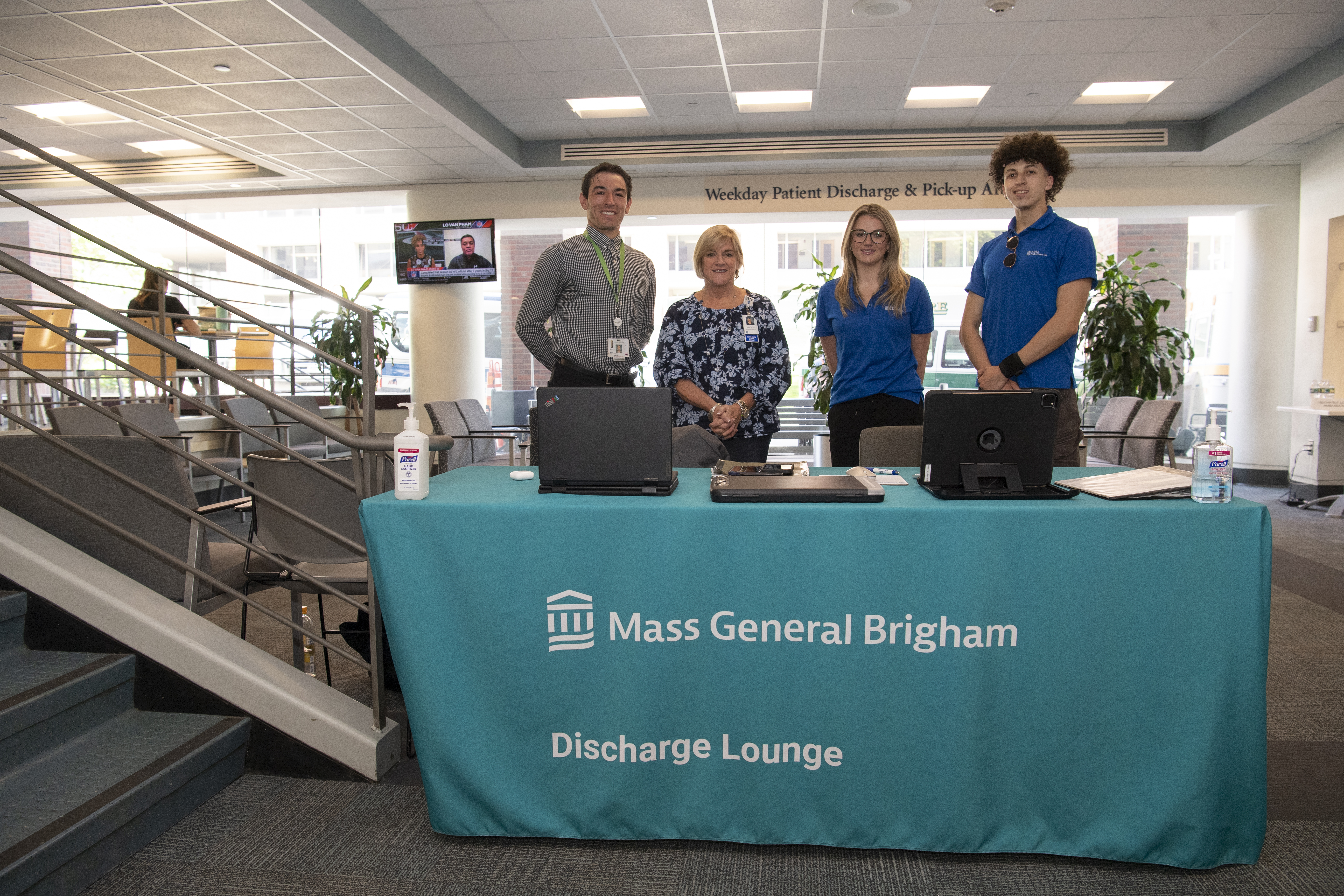 Discharge lounge staff stand at the lounge entrance